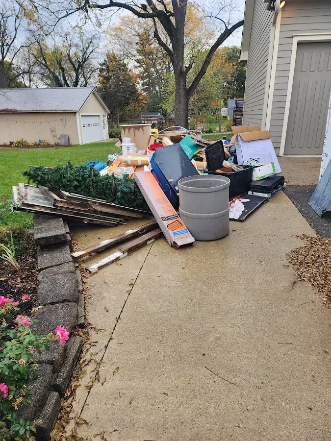 Dumpster being loaded with debris for Demolition Dumpster Rental in North East